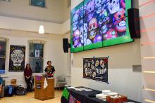 A student speaker presents on Day of the Dead