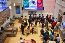An overhead shot of Williams Hall showing ~30 participants enjoying the Day of the Dead event